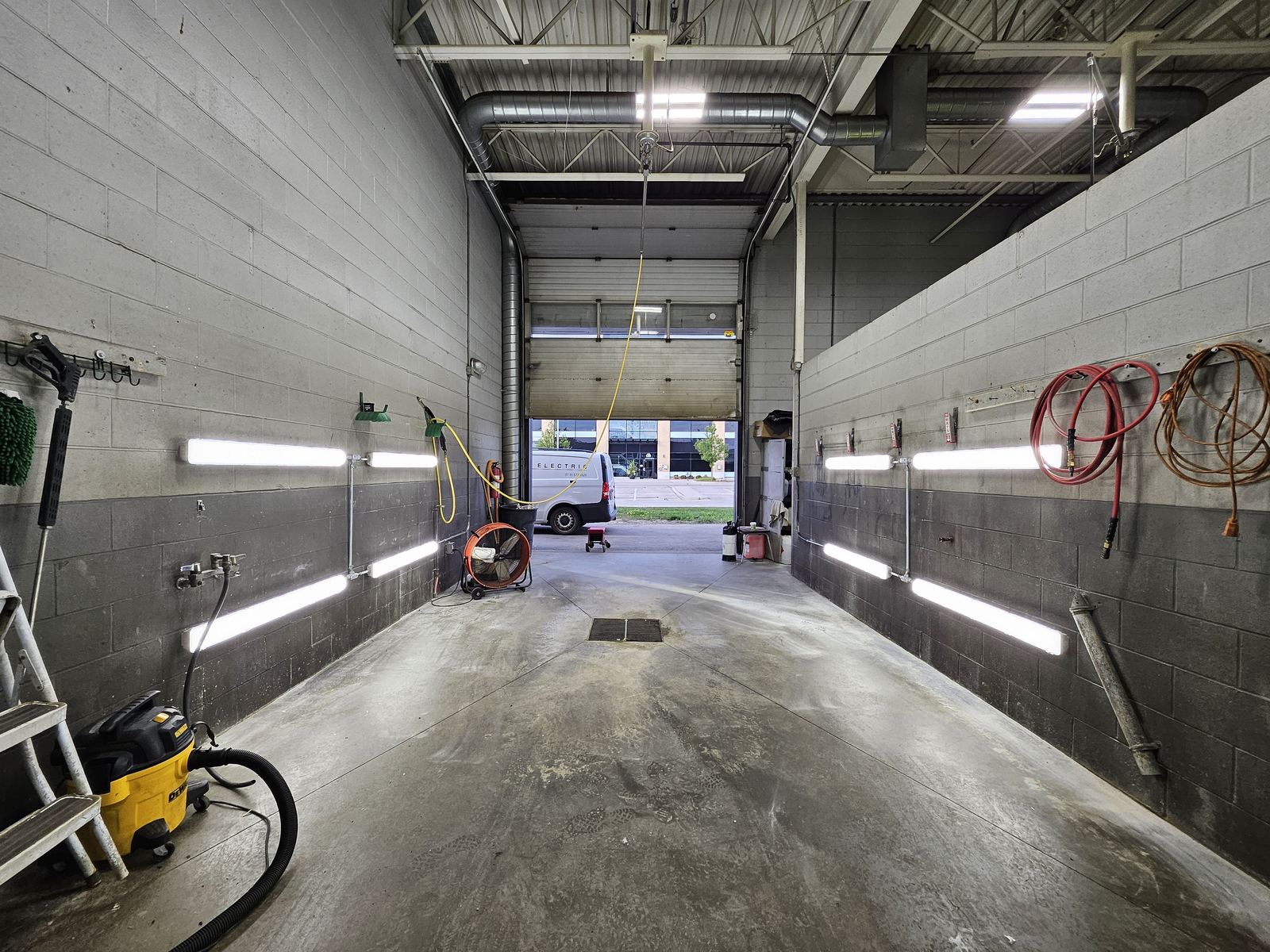 Commercial garage lit by LED high-bay fixtures installed by Ber Electric