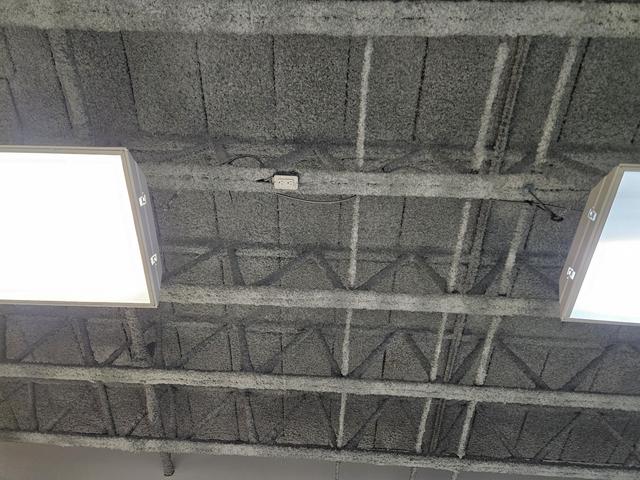 Parking structure ceiling with overhead lighting
